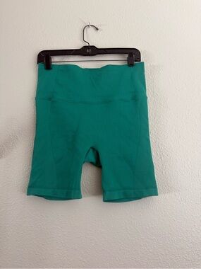 all in motion Women's High-Rise Athletic Bike Shorts in Teal Green